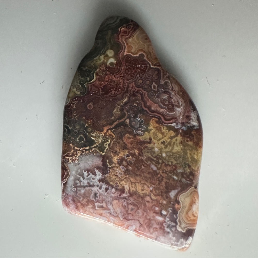 Crazy Lace tube agate cabochon from Horse Canyon